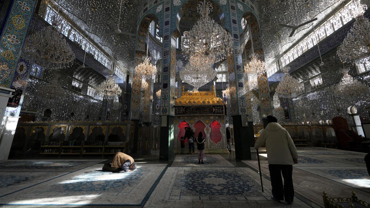 Fear and prayers in the Shiite mausoleum