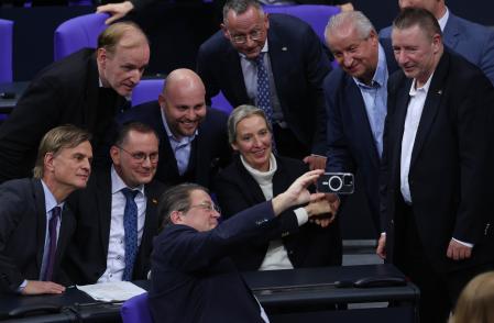 AFD members celebrating the conservative motion